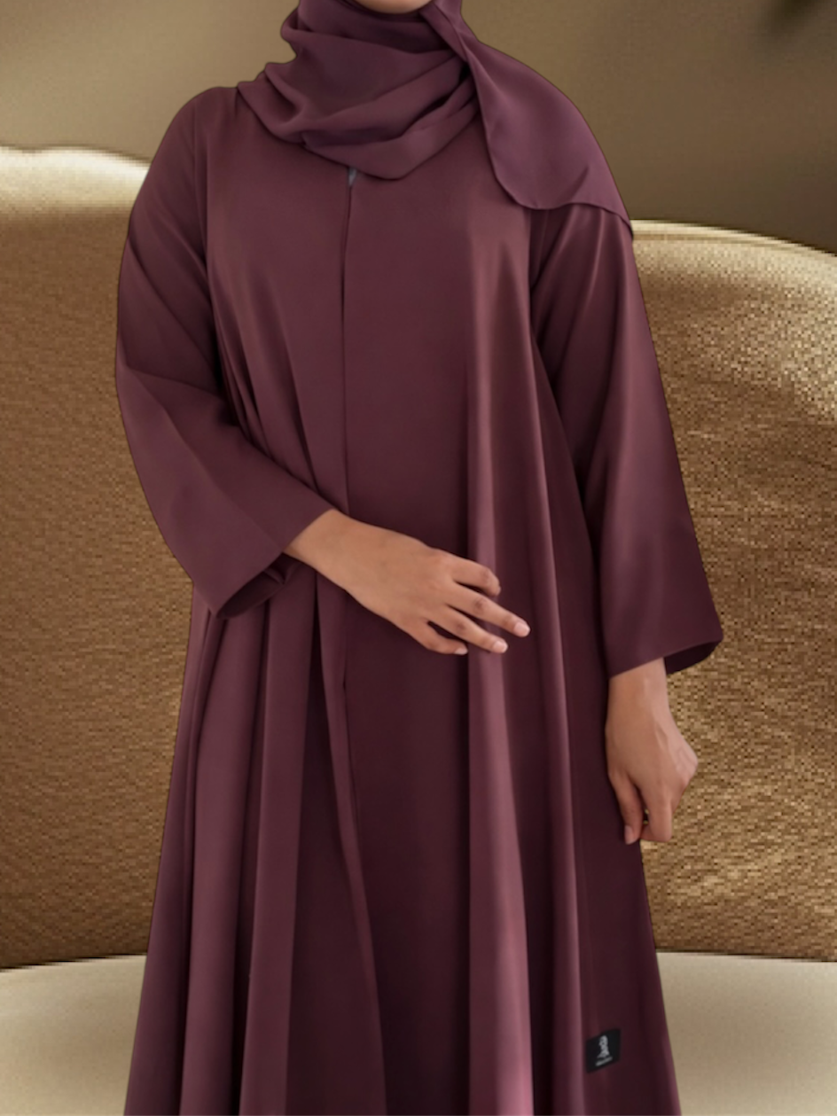 Elegant Flow Abaya – Burgundy
Step into effortless elegance with this beautifully crafted burgundy abaya. Designed with a graceful flow and a relaxed silhouette, this piece blends timeless modesty with modern sophistication. The soft, lightweight fabric