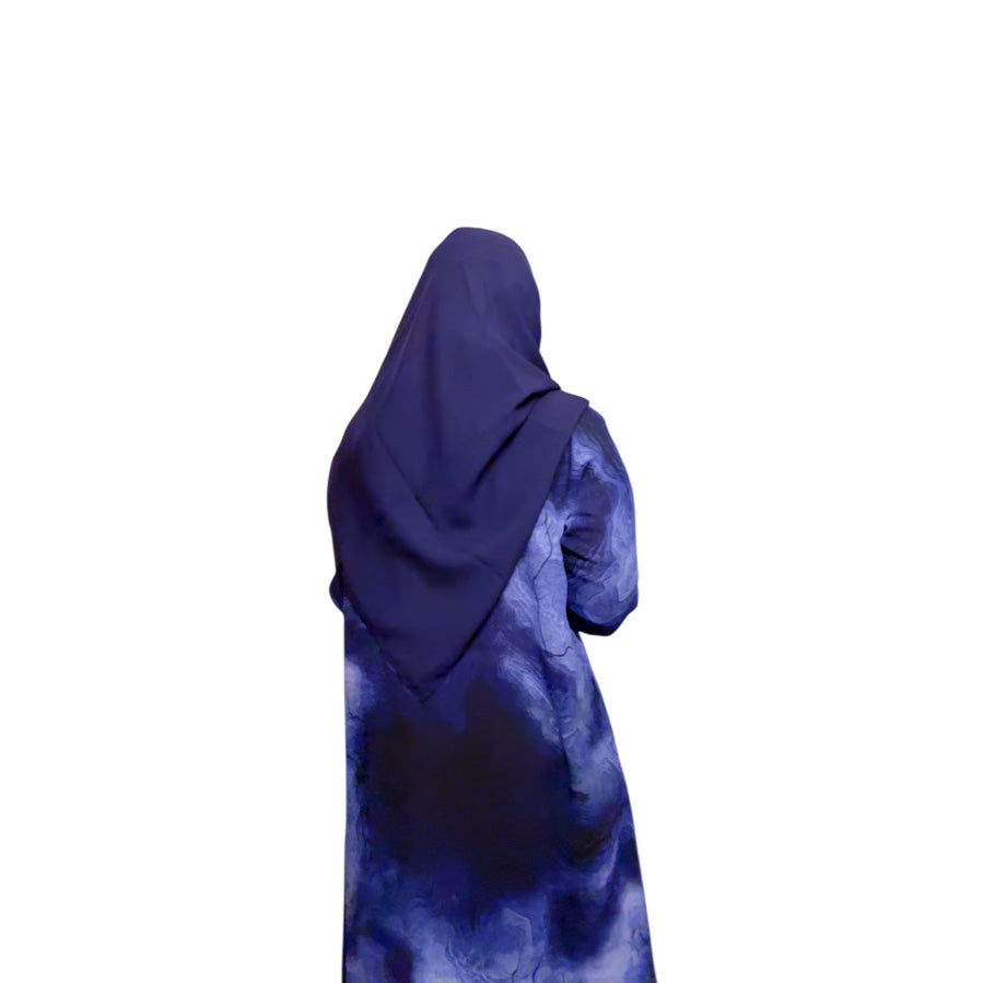 Oceanic elegance in every fold—this navy-blue abaya features a dreamy, wave-like print that flows beautifully with every step. Paired with a matching scarf for a seamless look.