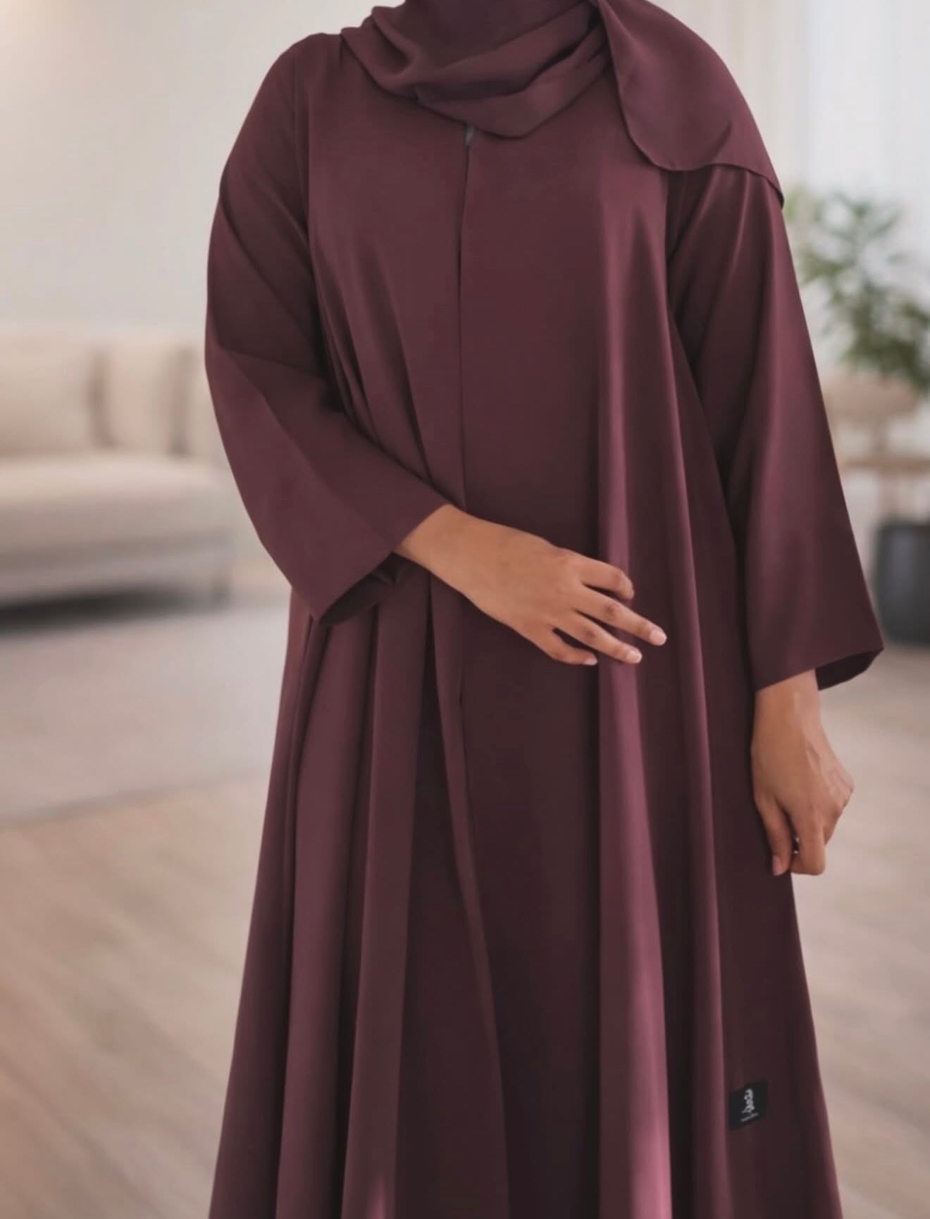 Elegant Flow Abaya – Burgundy

Step into effortless elegance with this beautifully crafted burgundy abaya. Designed with a graceful flow and a relaxed silhouette, this piece blends timeless modesty with modern sophistication. The soft, lightweight fabric
