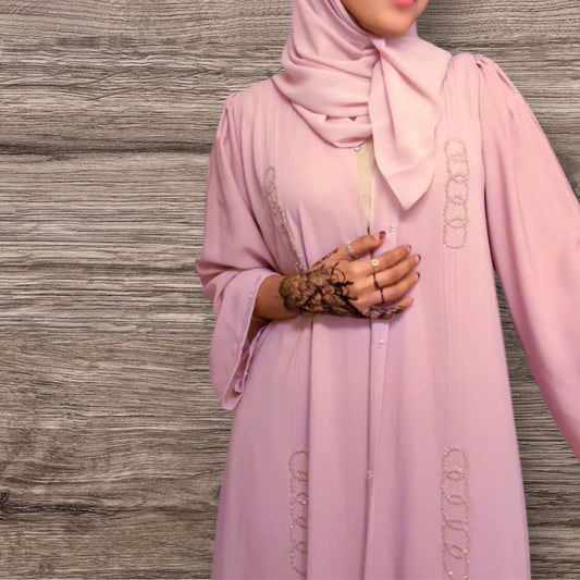 This elegant abaya features a soft flowing wave-inspired print, designed for a graceful and modest look.
Crafted from lightweight, comfortable fabric and paired with a matching scarf for a complete outfit.