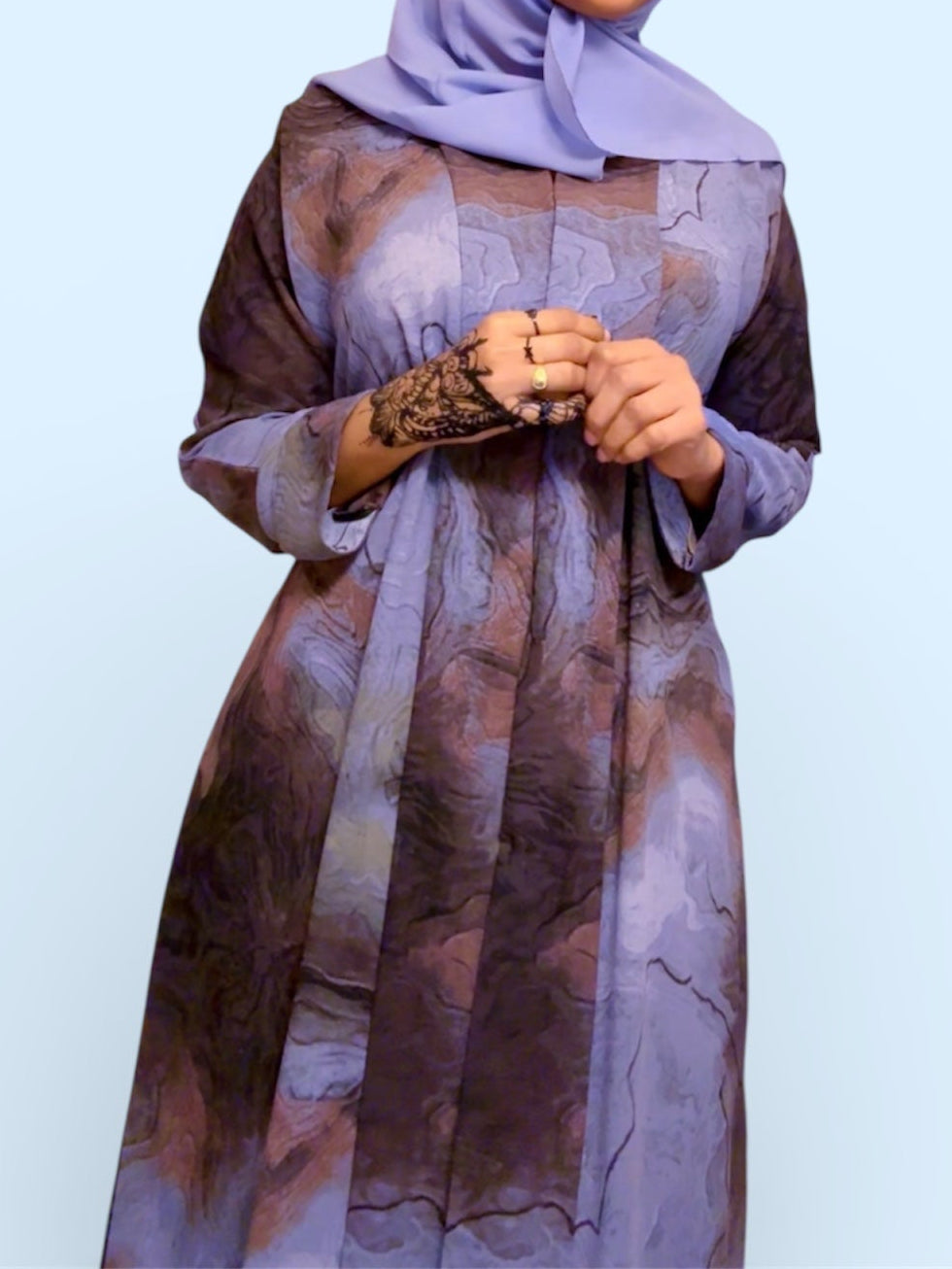'' Oceanic elegance in every fold—this navy-blue abaya features a dreamy, wave-like print that flows beautifully with every step. Paired with a matching scarf for a seamless look.